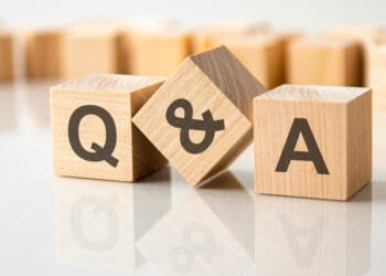 Wooden blocks with Q and A letters – BIC Immigration visa questions and answers support